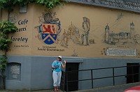  Carolyn saying Hi in front of a large mural.