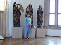  Carolyn poses with statues in the Heraldic Hall.  This ends our tour of the castle.